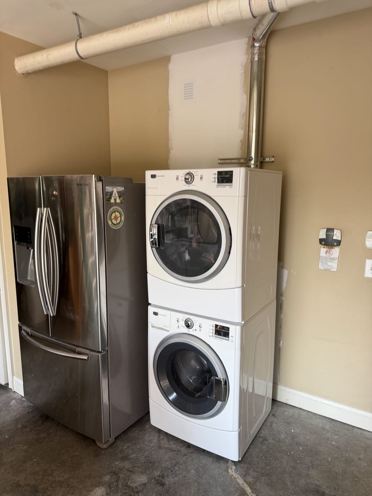 Washing machine water supply and drain connections installed in a laundry box
