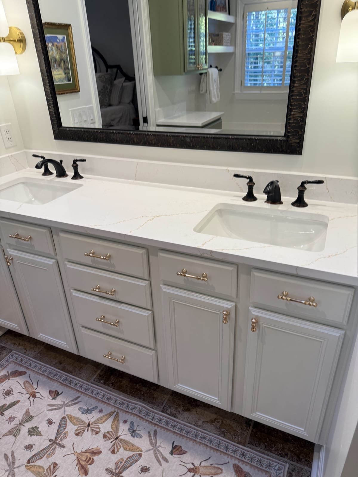 Double vanity with two sinks and matching faucets installed in a bathroom