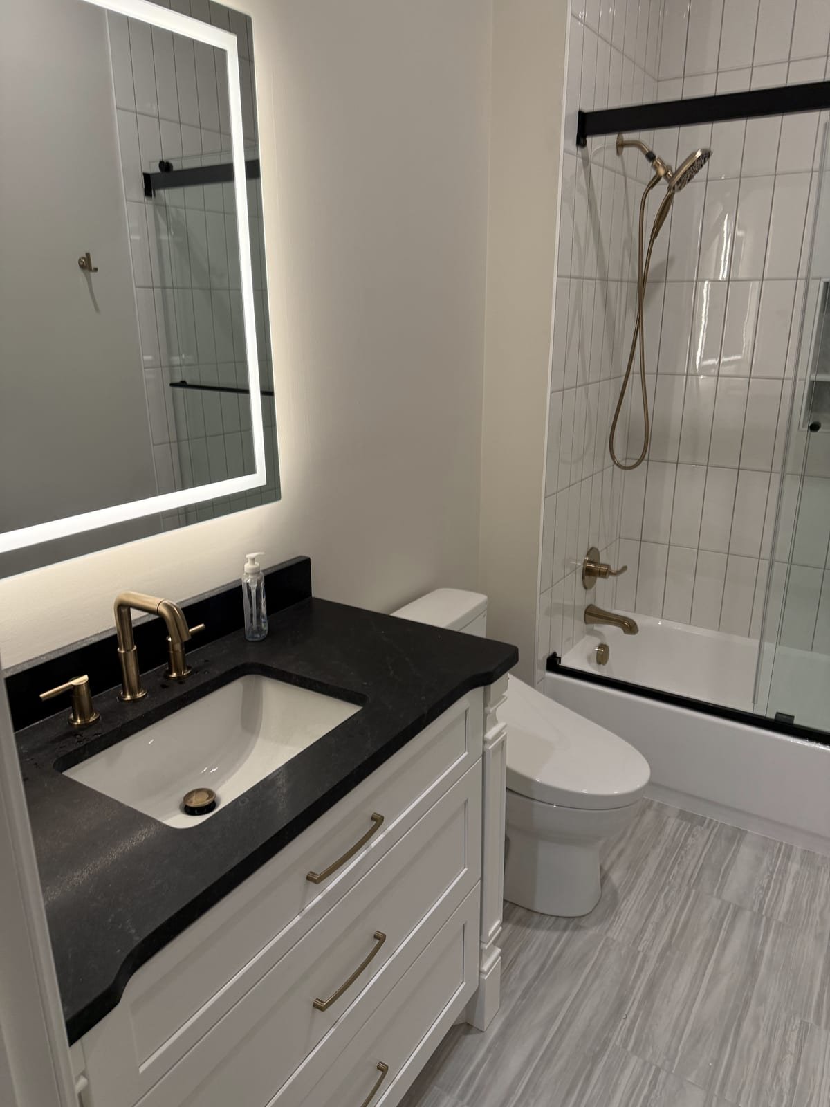 Finished guest bathroom with new toilet, sink and fixtures