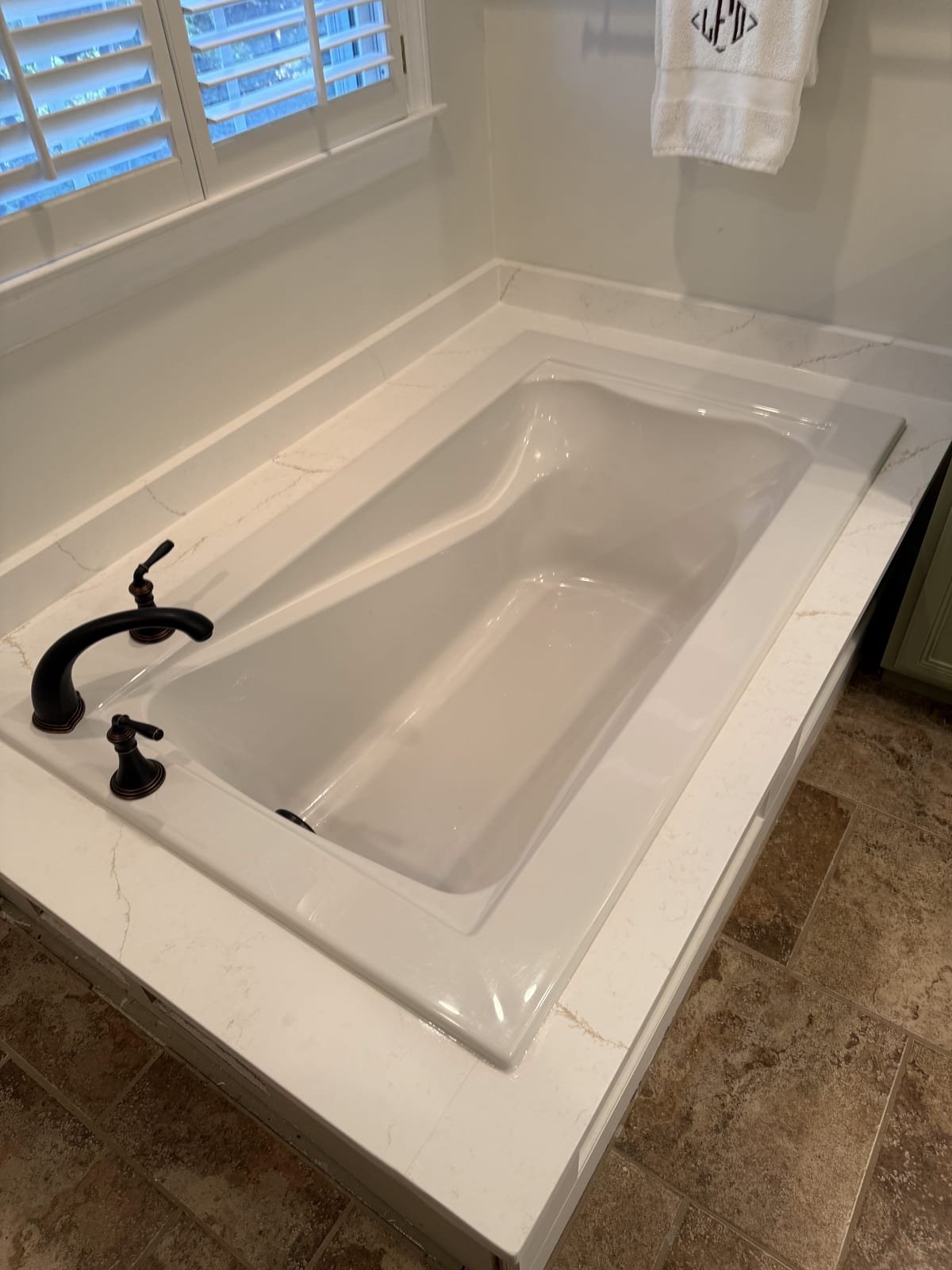 Installed soaking tub with new supply and drain connections
