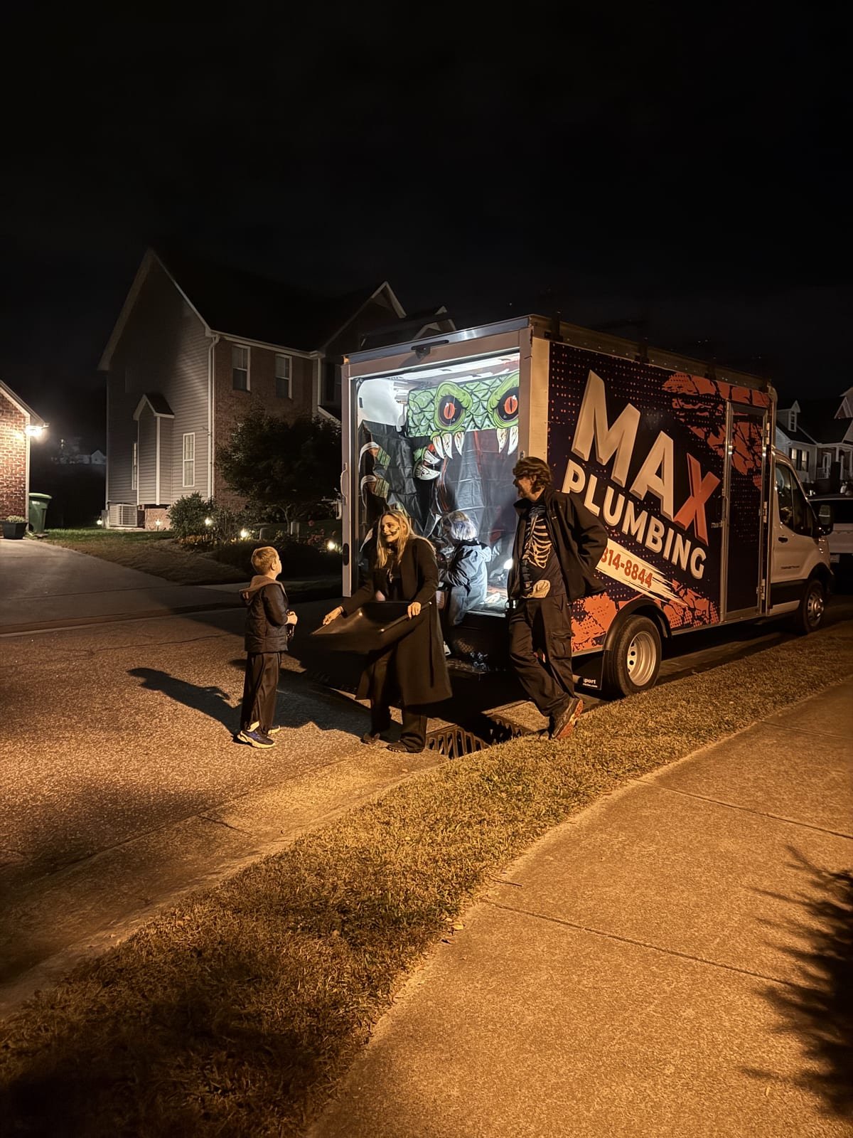 MAX Plumbing at a community Halloween event