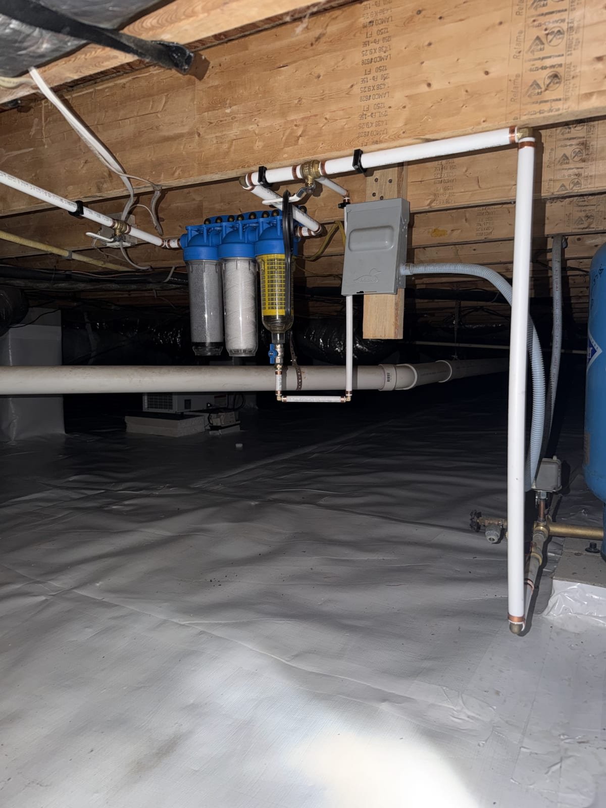 Three-stage sediment filtration system mounted on a wall