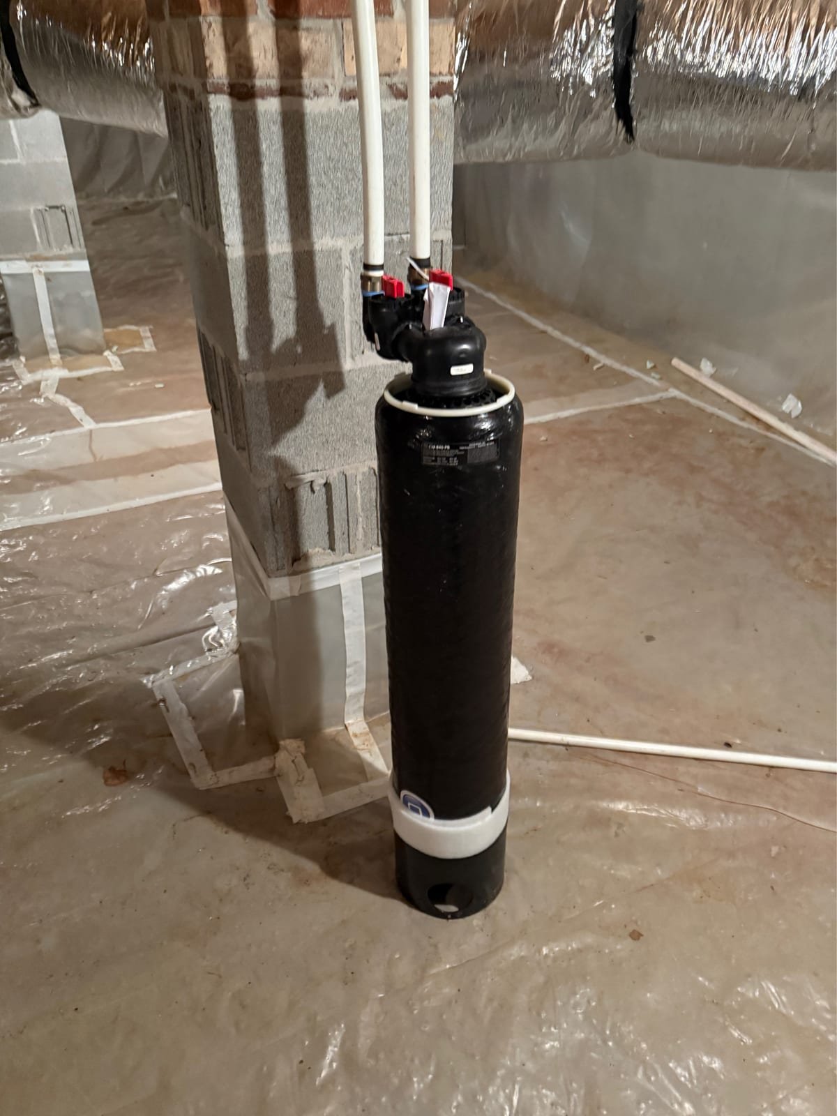 Large capacity whole-home water filter installed with inlet and outlet valves