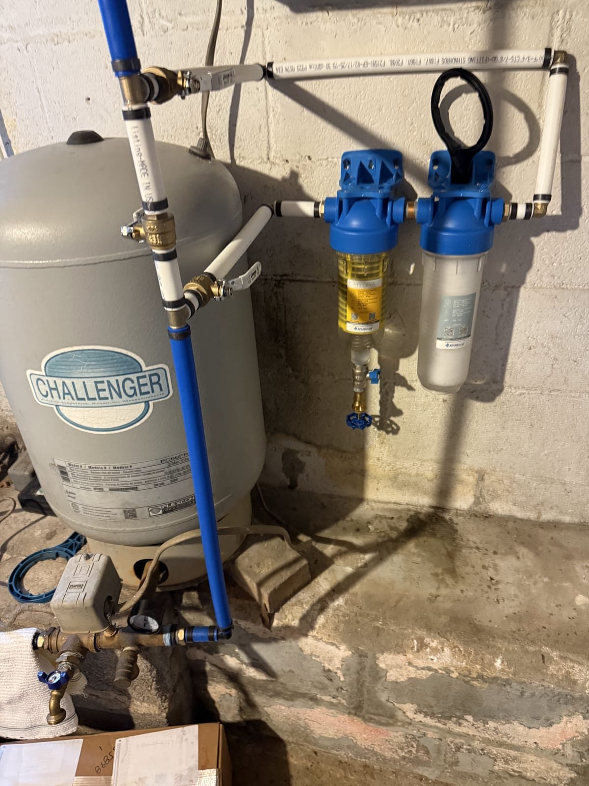 Sediment filter housing installed on an incoming water line