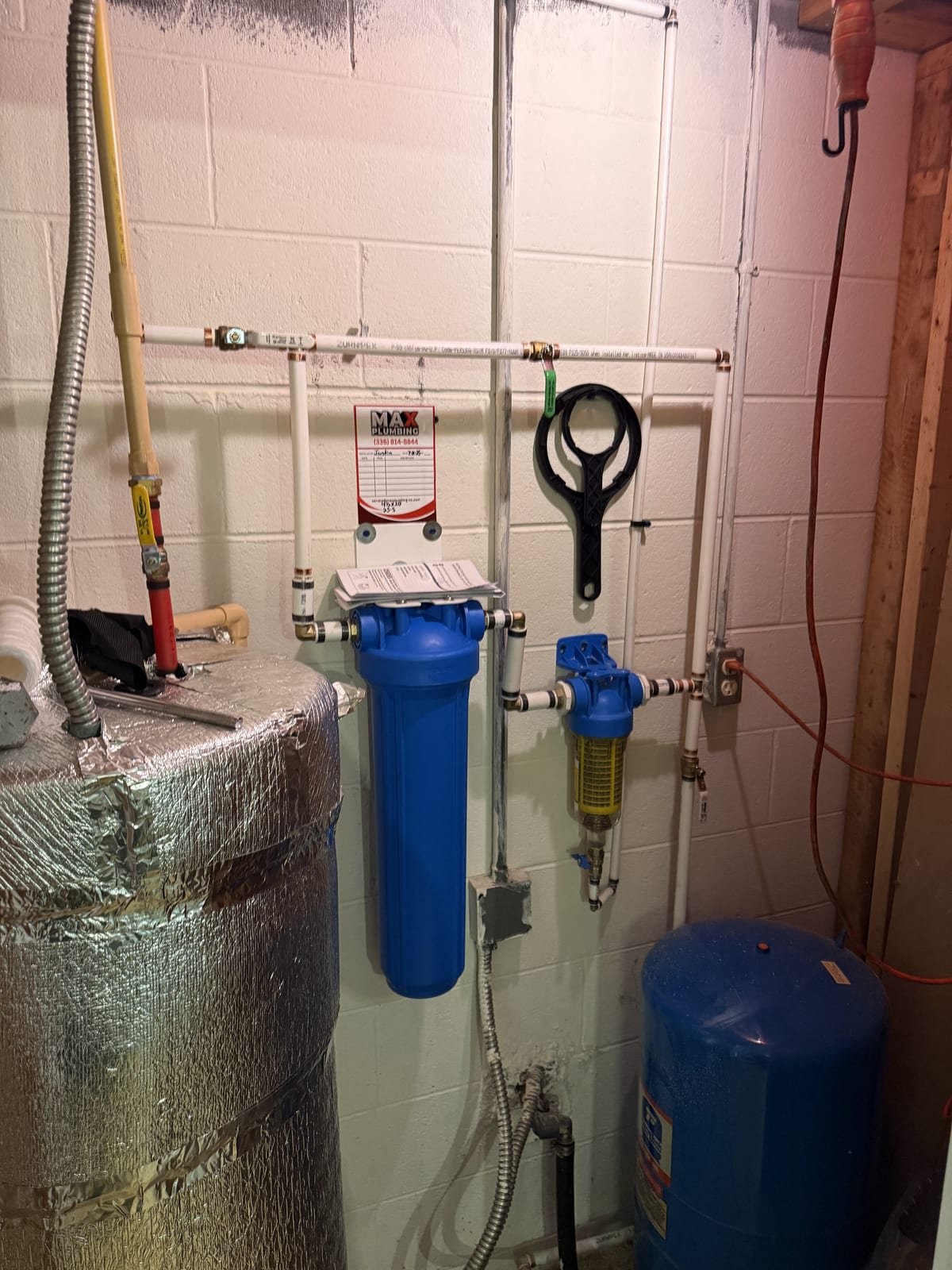 Spin-down pre-filter installed alongside a cartridge sediment filter
