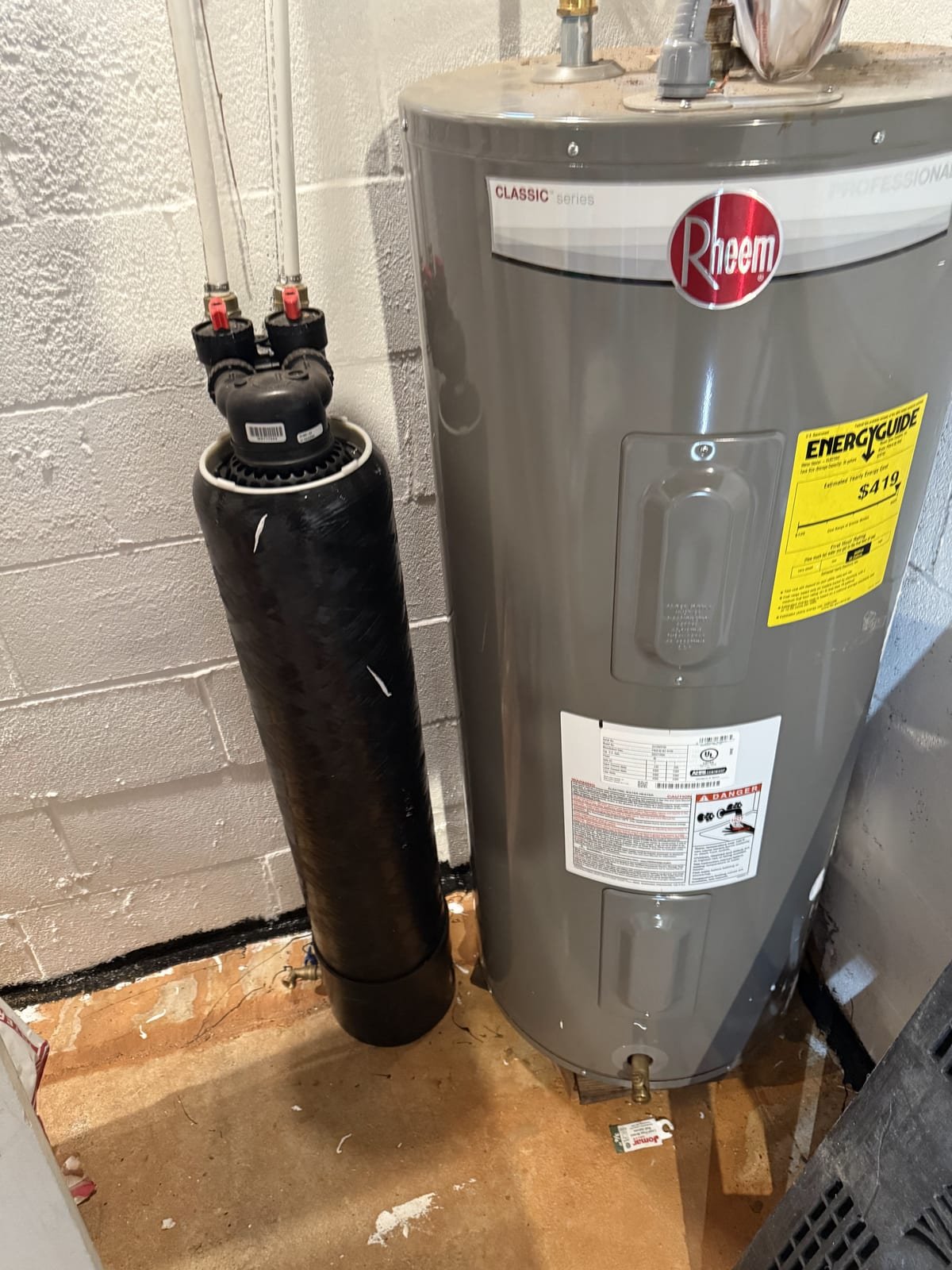 Large whole-house water filtration tank installed on a main supply line