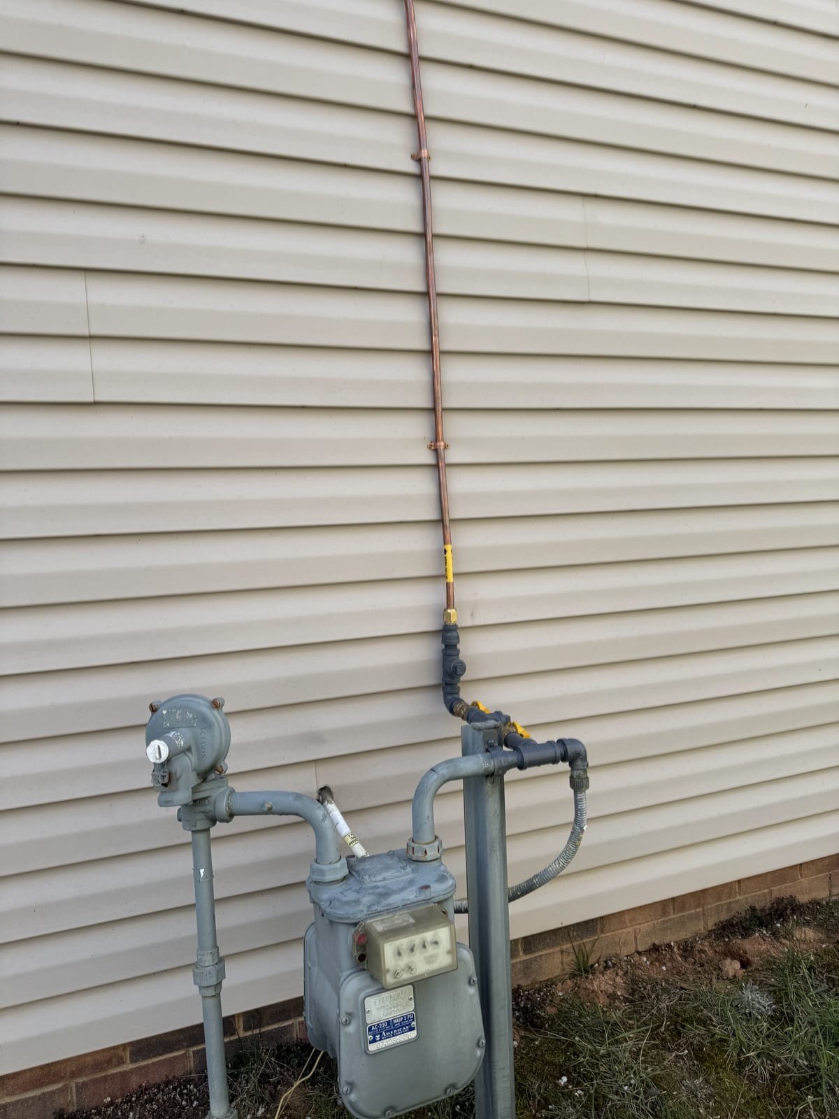 Newly installed gas line with pressure test gauge attached