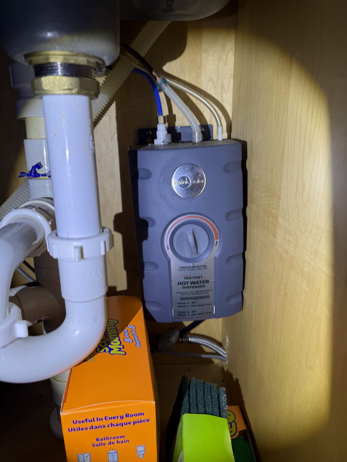 Instant hot water dispenser installed at a kitchen sink