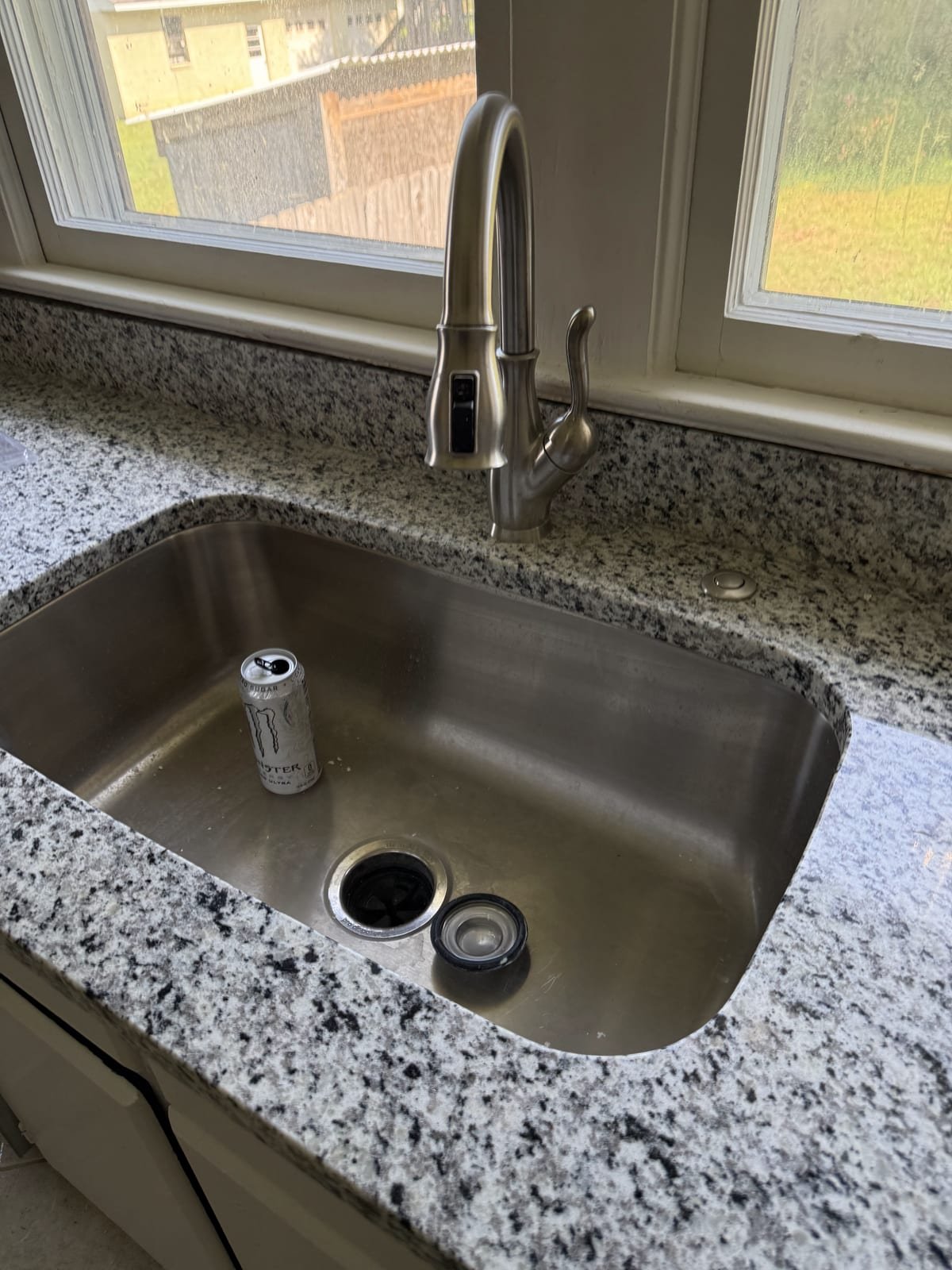 Newly installed kitchen faucet with pull-down sprayer