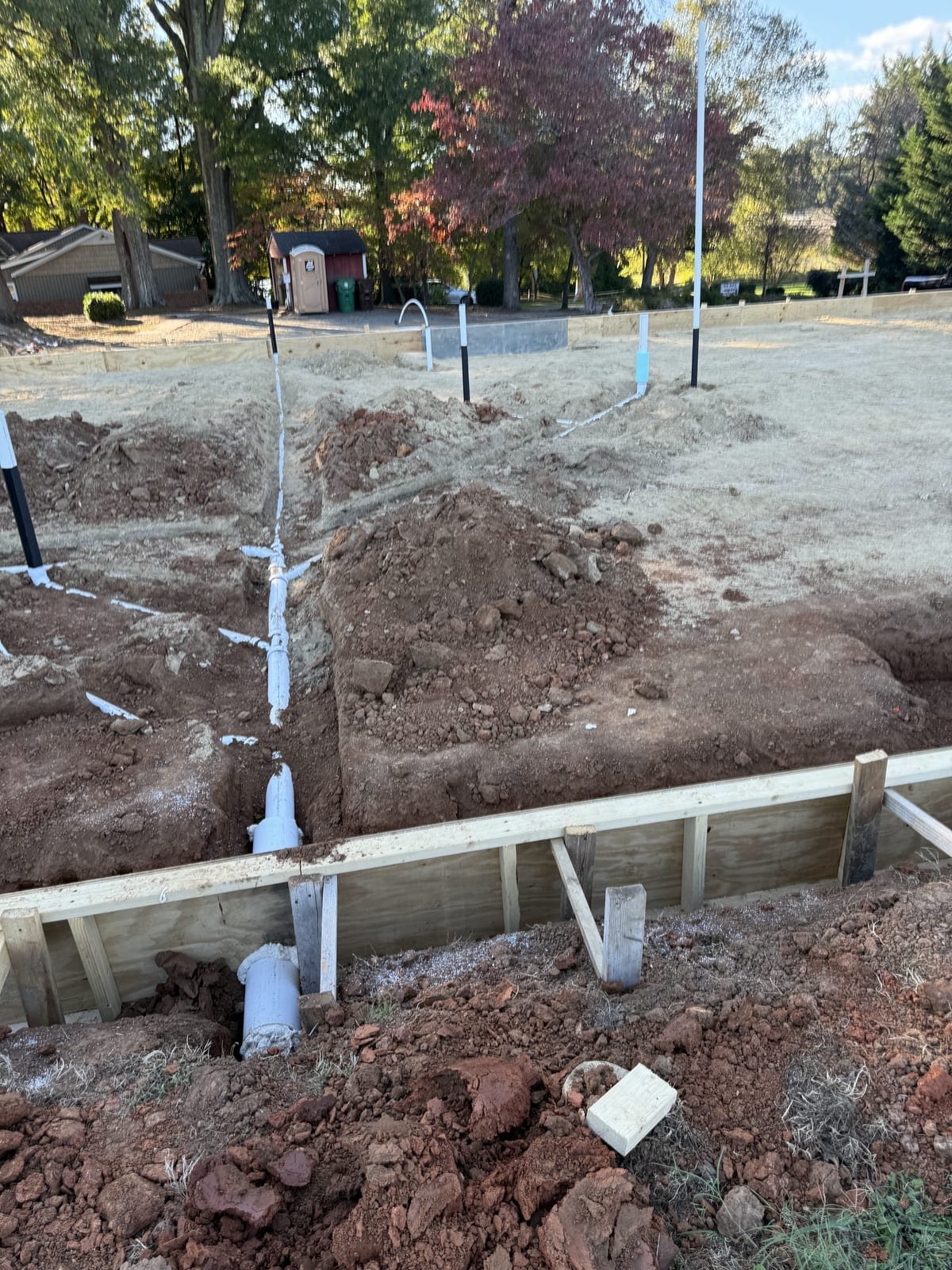 Under-slab drain lines positioned and secured ahead of concrete work