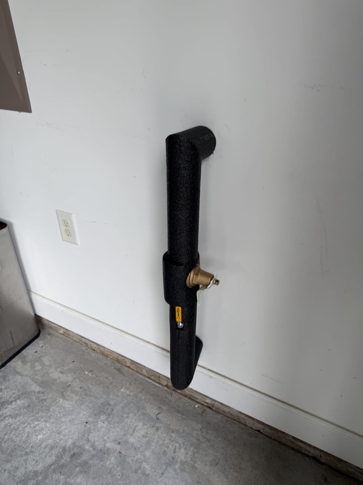 Pressure reducing valve wrapped in pipe insulation for freeze protection