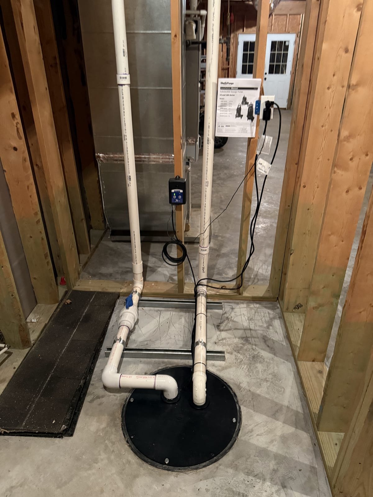 Replacement sewage pump installed with new check valve and discharge line
