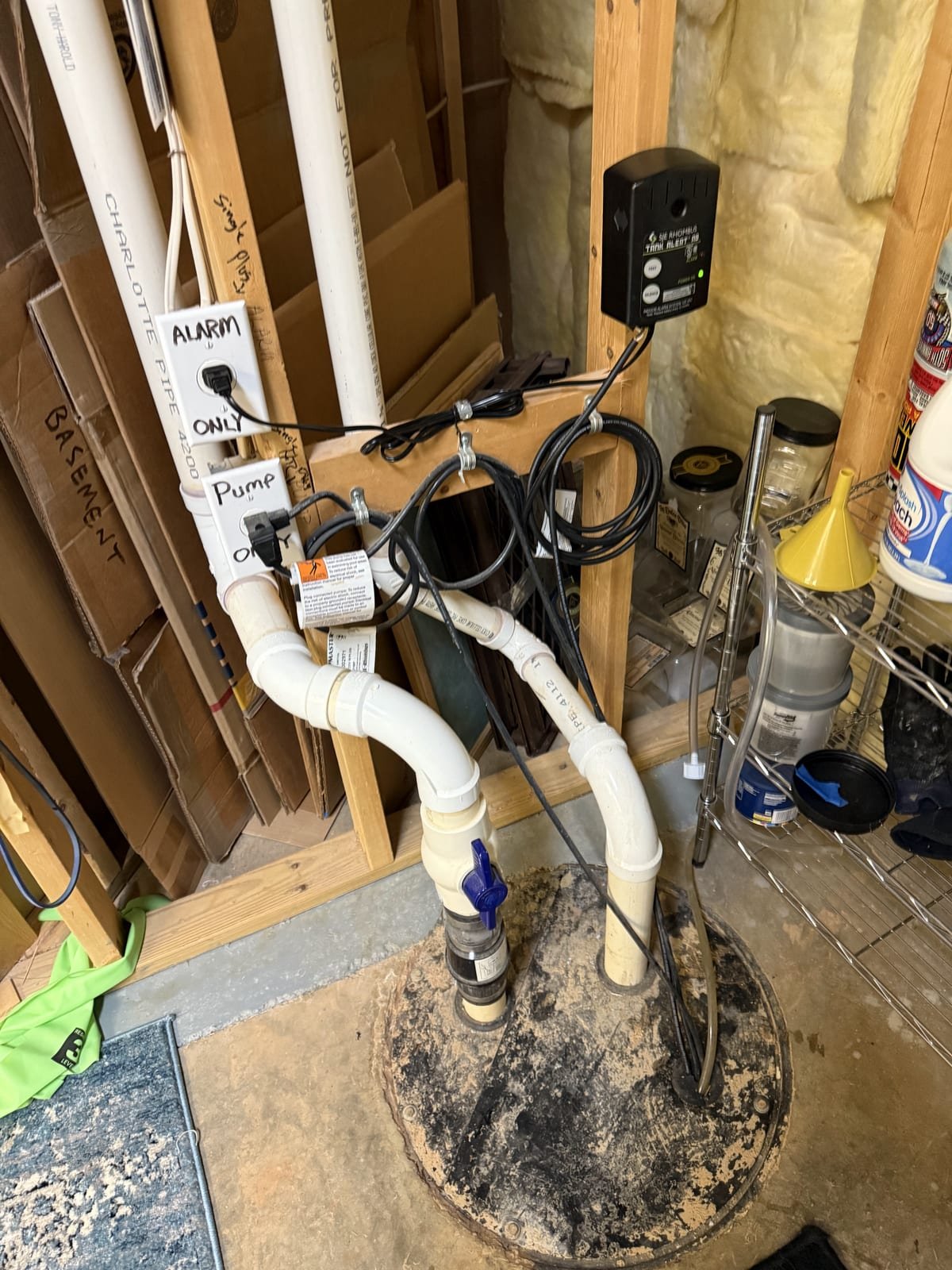 Sewage ejector pump installed in a basin with discharge piping