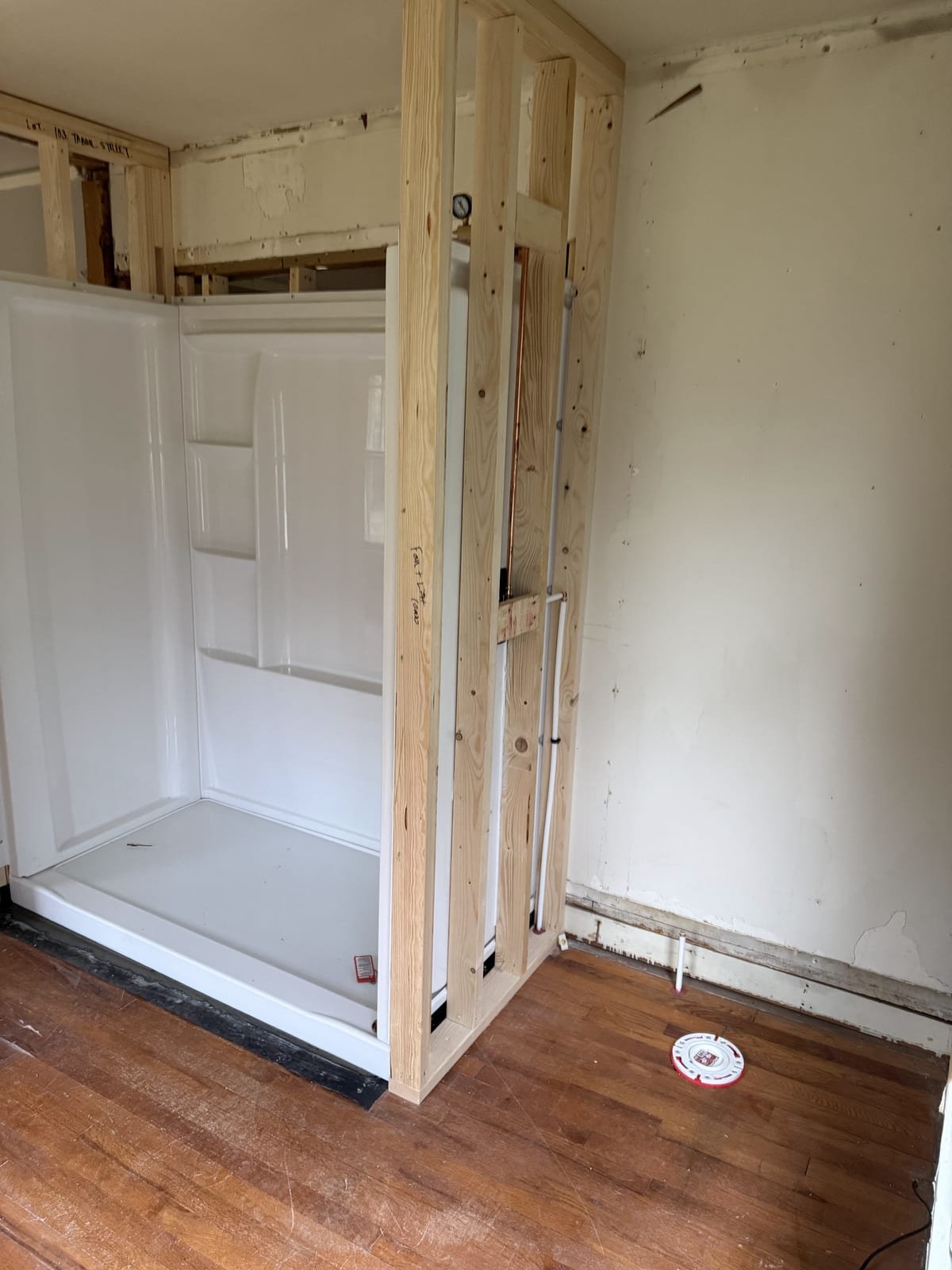 New shower plumbing roughed in during a bathroom remodel