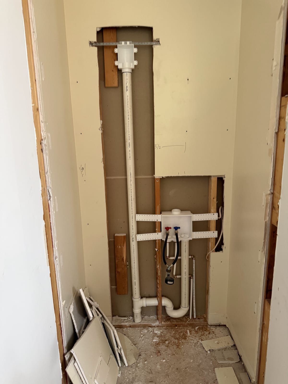 New laundry connections roughed in at a relocated laundry area