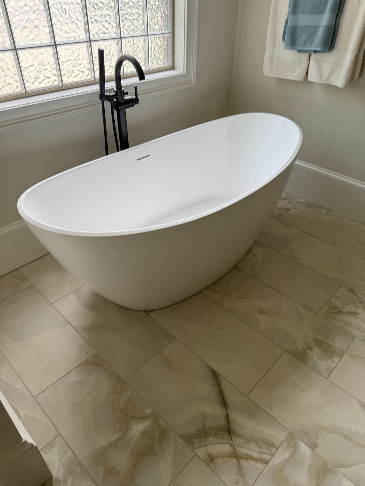 Freestanding tub installed as part of a bathroom remodel