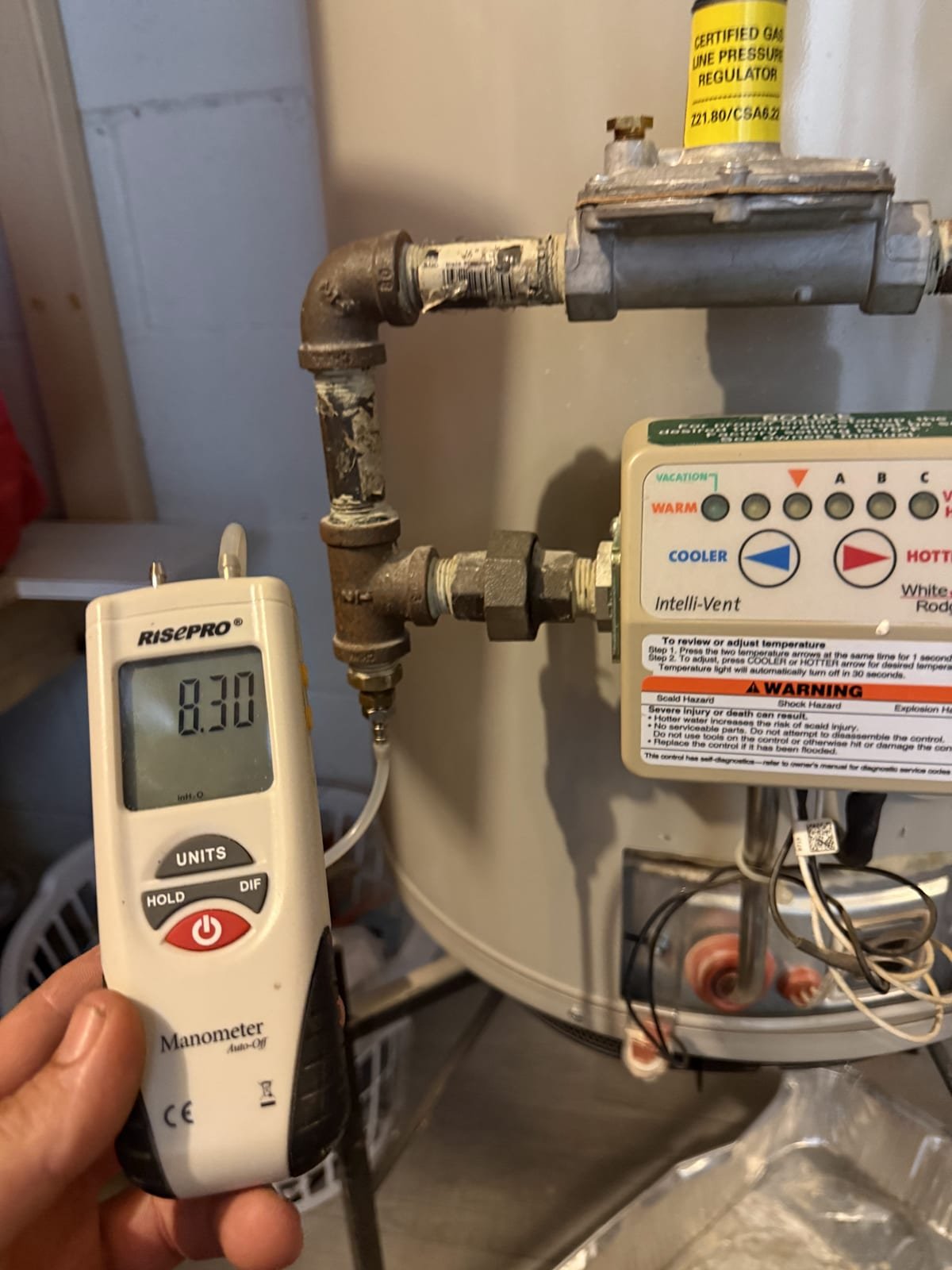 Gas pressure being measured with a manometer during a service call