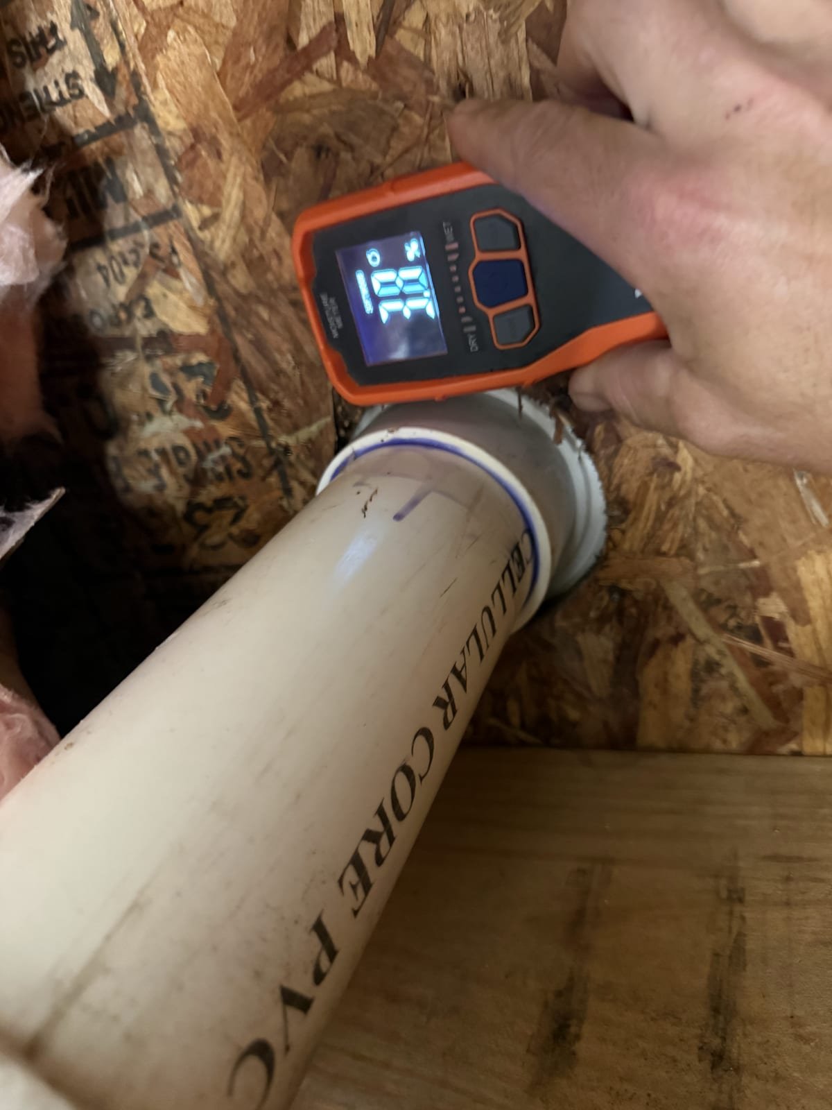 Moisture meter being used to check a wall for water intrusion