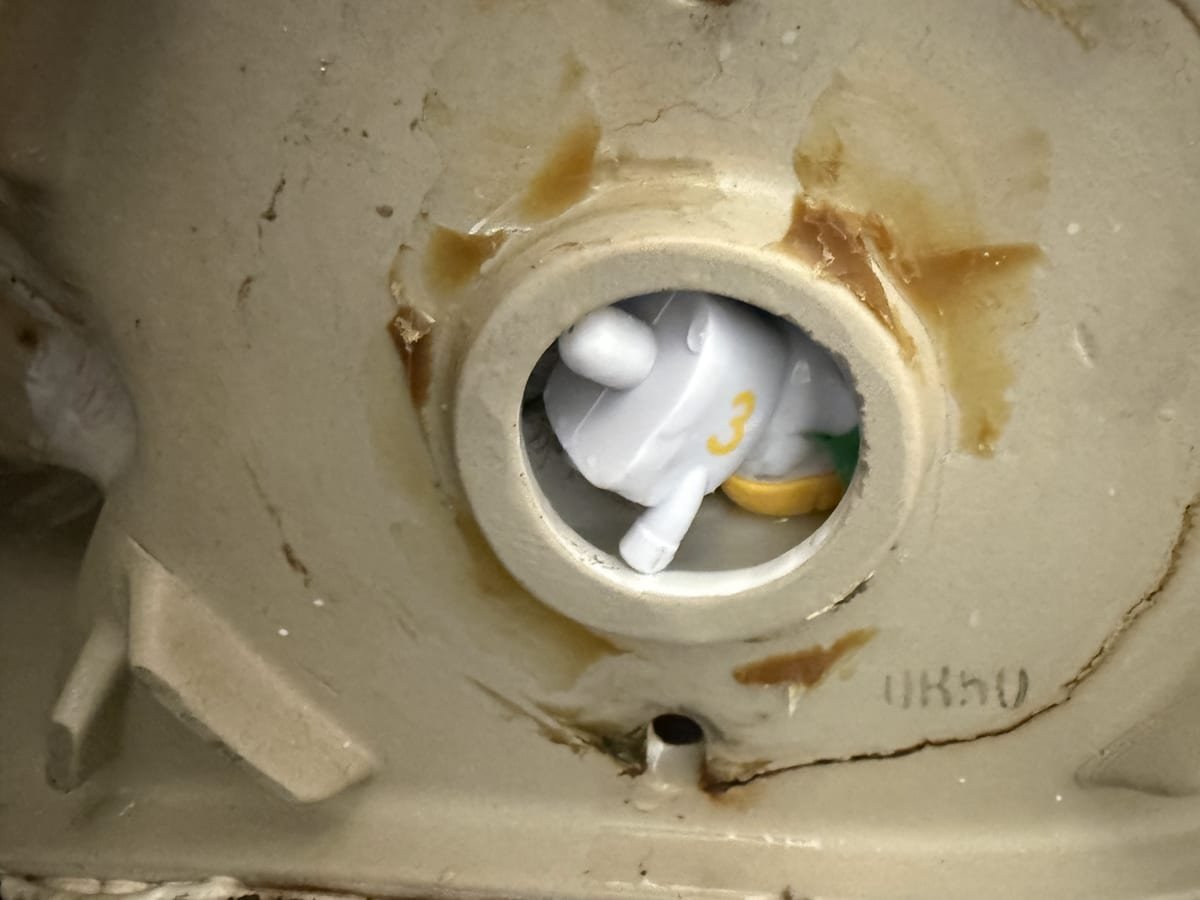 Camera view of a toy lodged inside a toilet trap causing a blockage
