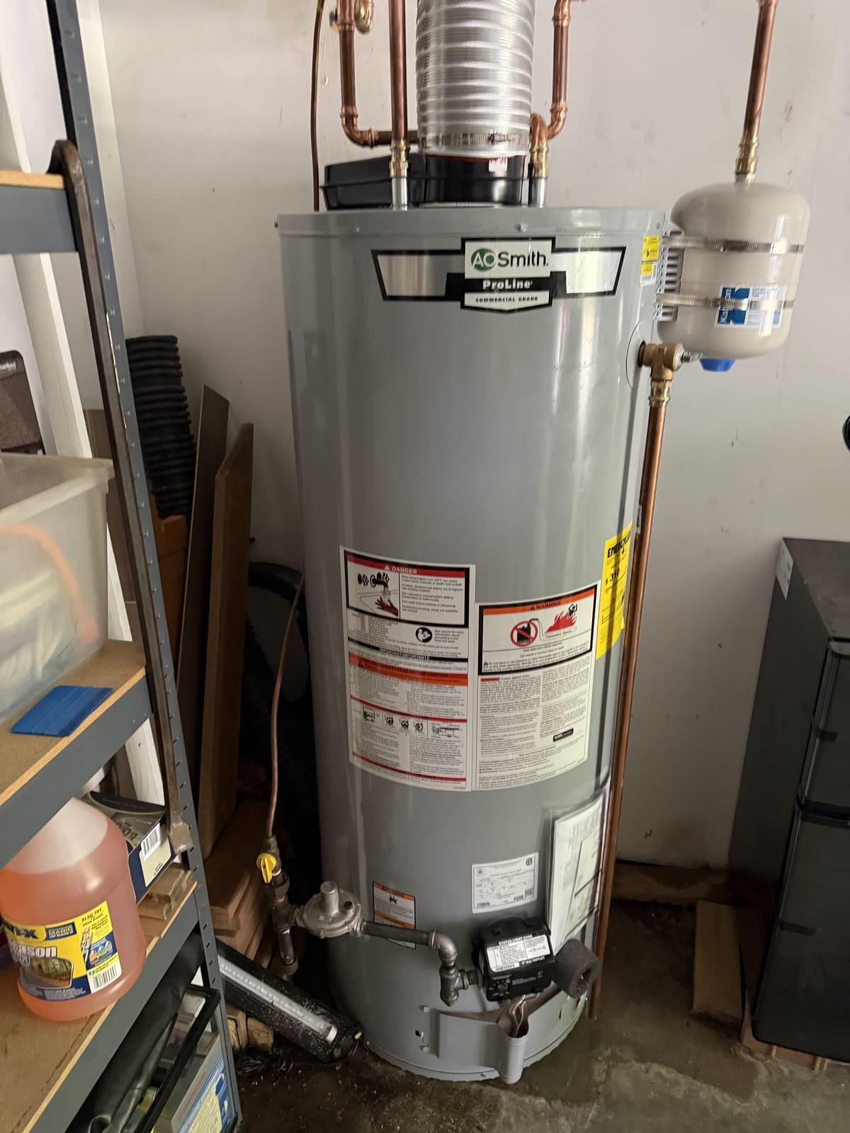 Direct-vent water heater installation with vent piping run to an exterior wall