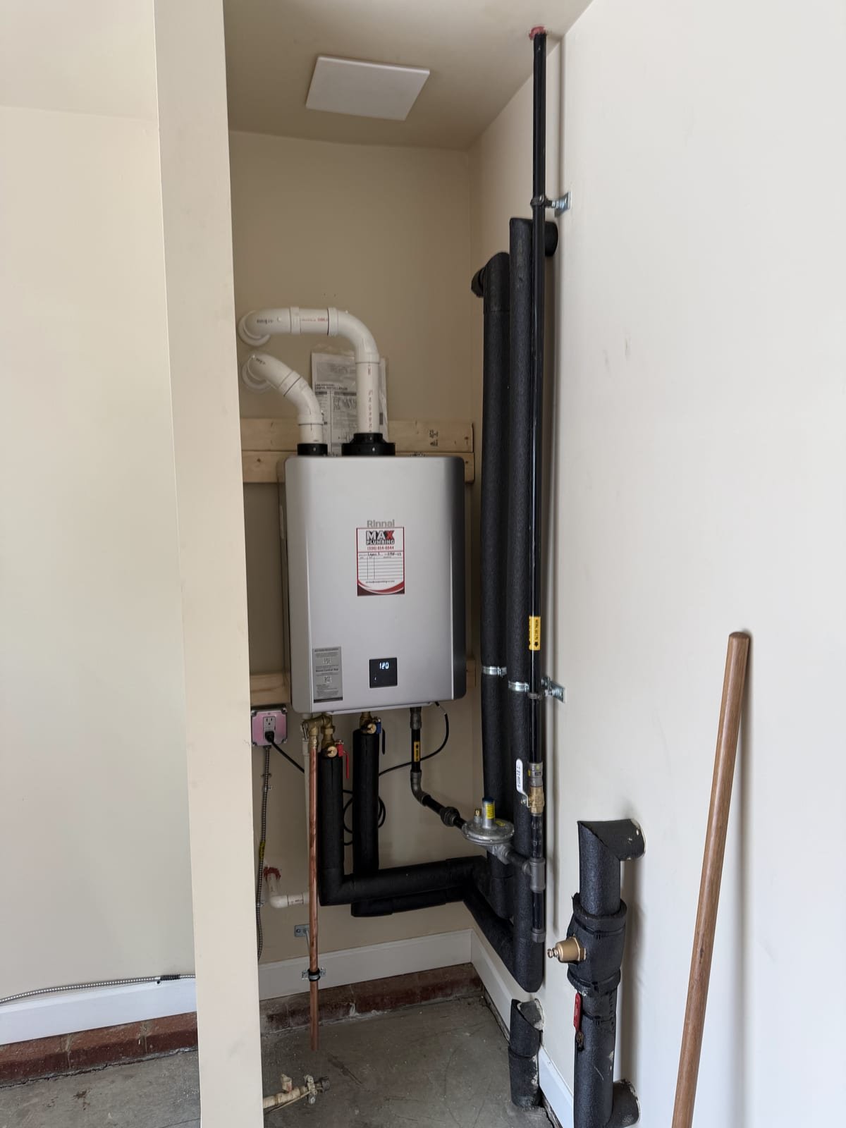 Tankless water heater installation with insulated hot and cold lines
